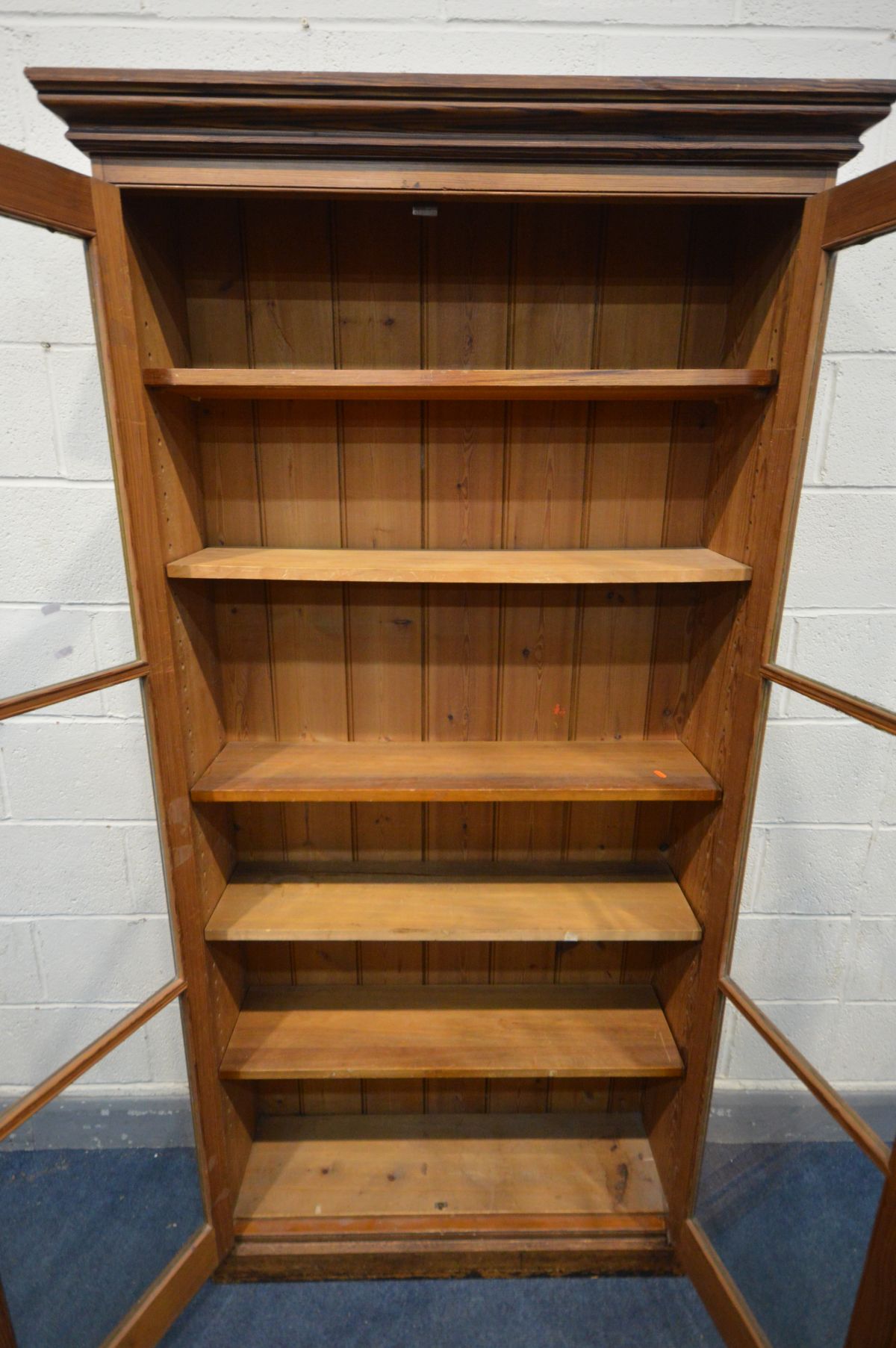 AN EARLY 20TH CENTURY PITCH PINE BOOKCASE, with double glazed doors enclosing five adjustable - Image 3 of 3