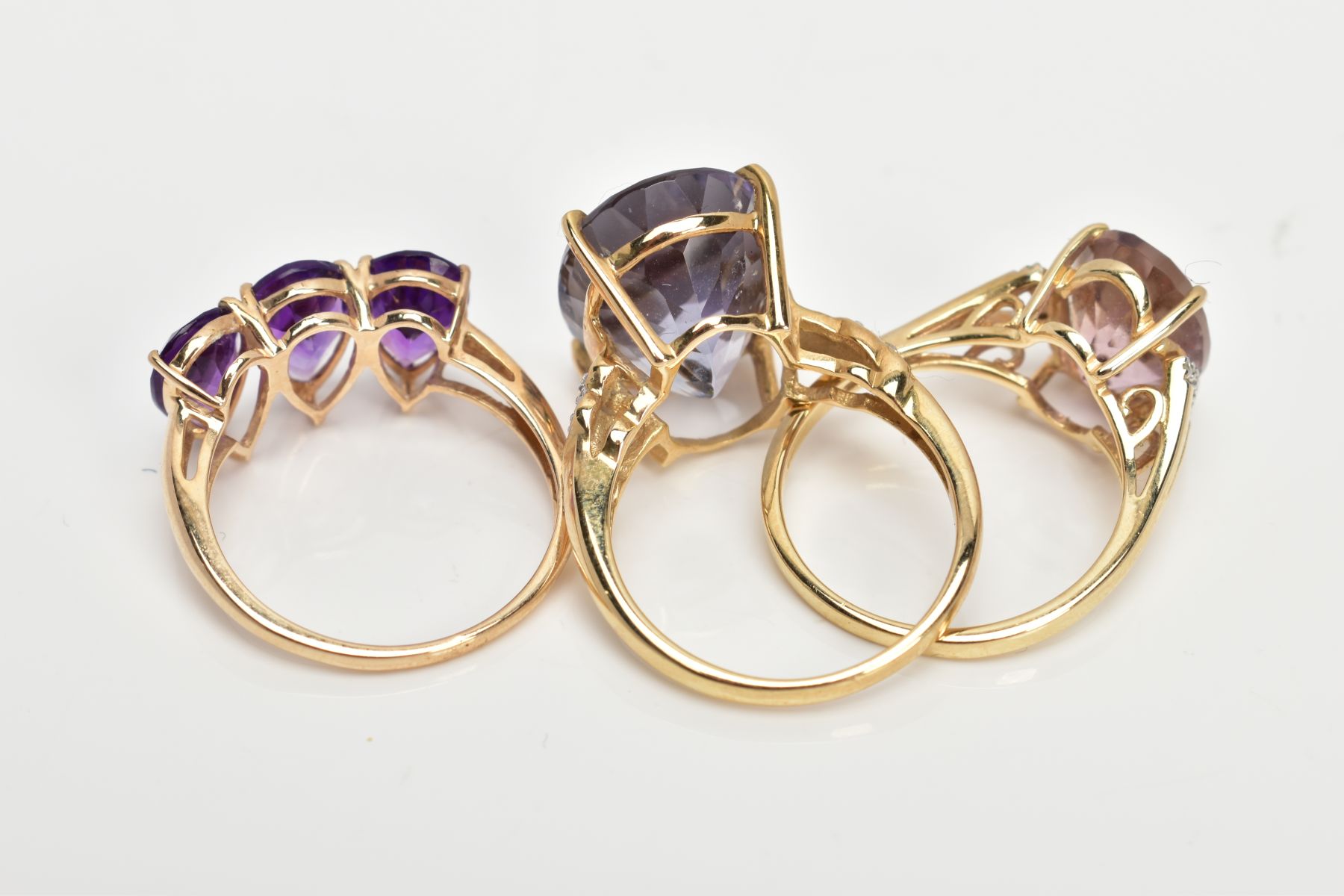 THREE 9CT GOLD AMETHYST DRESS RINGS, each set with vary cut amethysts, two set with single cut - Image 3 of 3