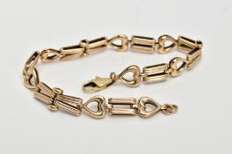A 9CT GOLD BRACELET, designed with textured tapered links interspaced with openwork heart links,