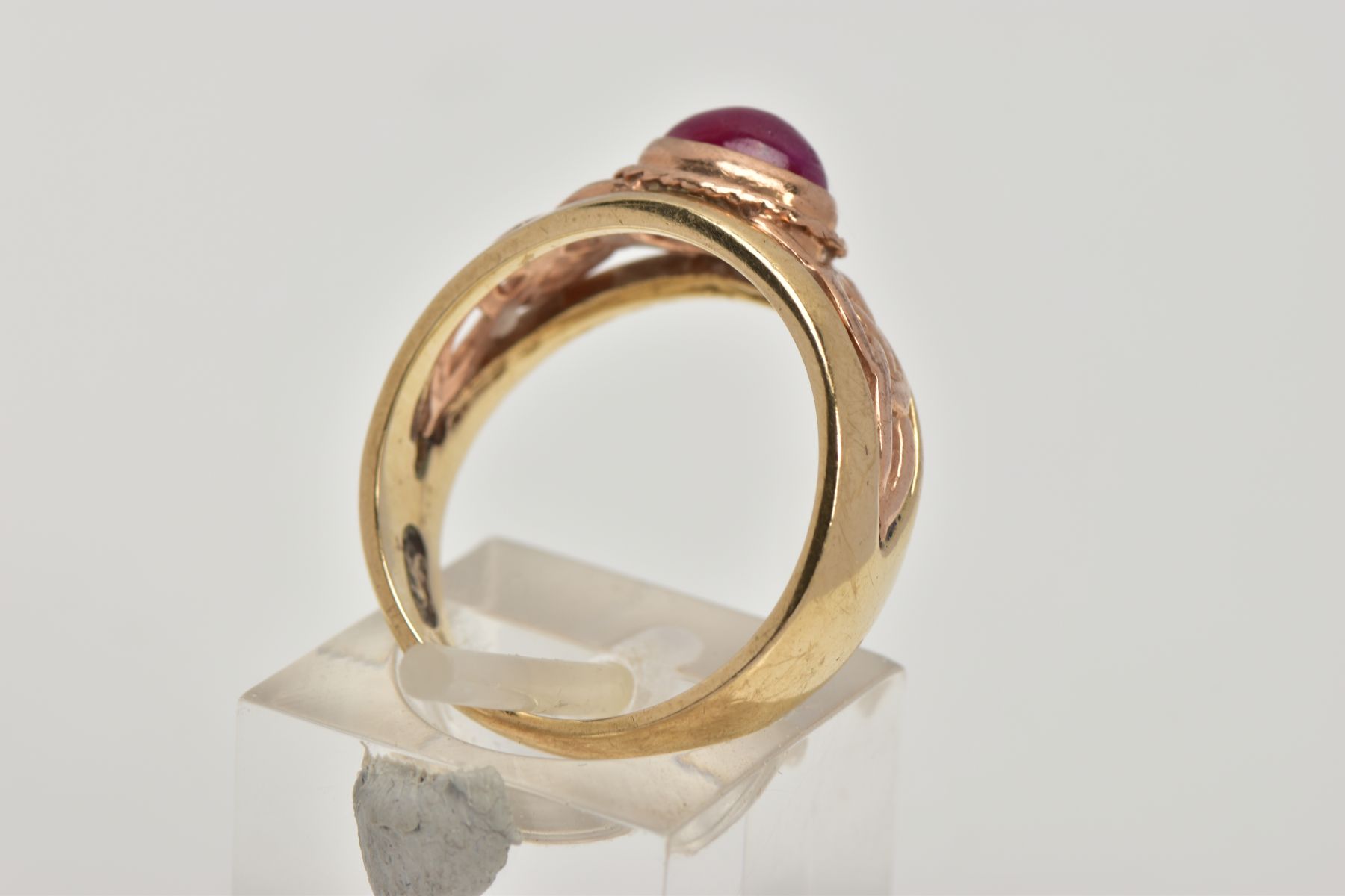 A 9CT GOLD 'CLOGAU' SIGNET RING, designed with a central oval ruby cabochon, collet mount with a - Image 3 of 5