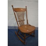 AN ARTS AND CRAFTS SPINDLE BACK ROCKING CHAIR