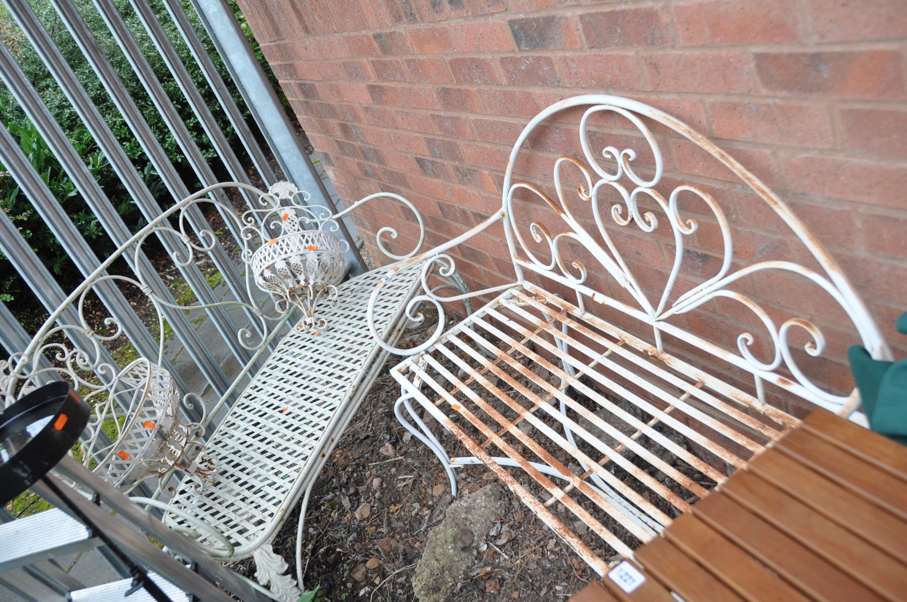 TWO ORNATE METAL MODERN GARDEN BENCHES both with scrolled detailing one 120cm wide the other 110cm