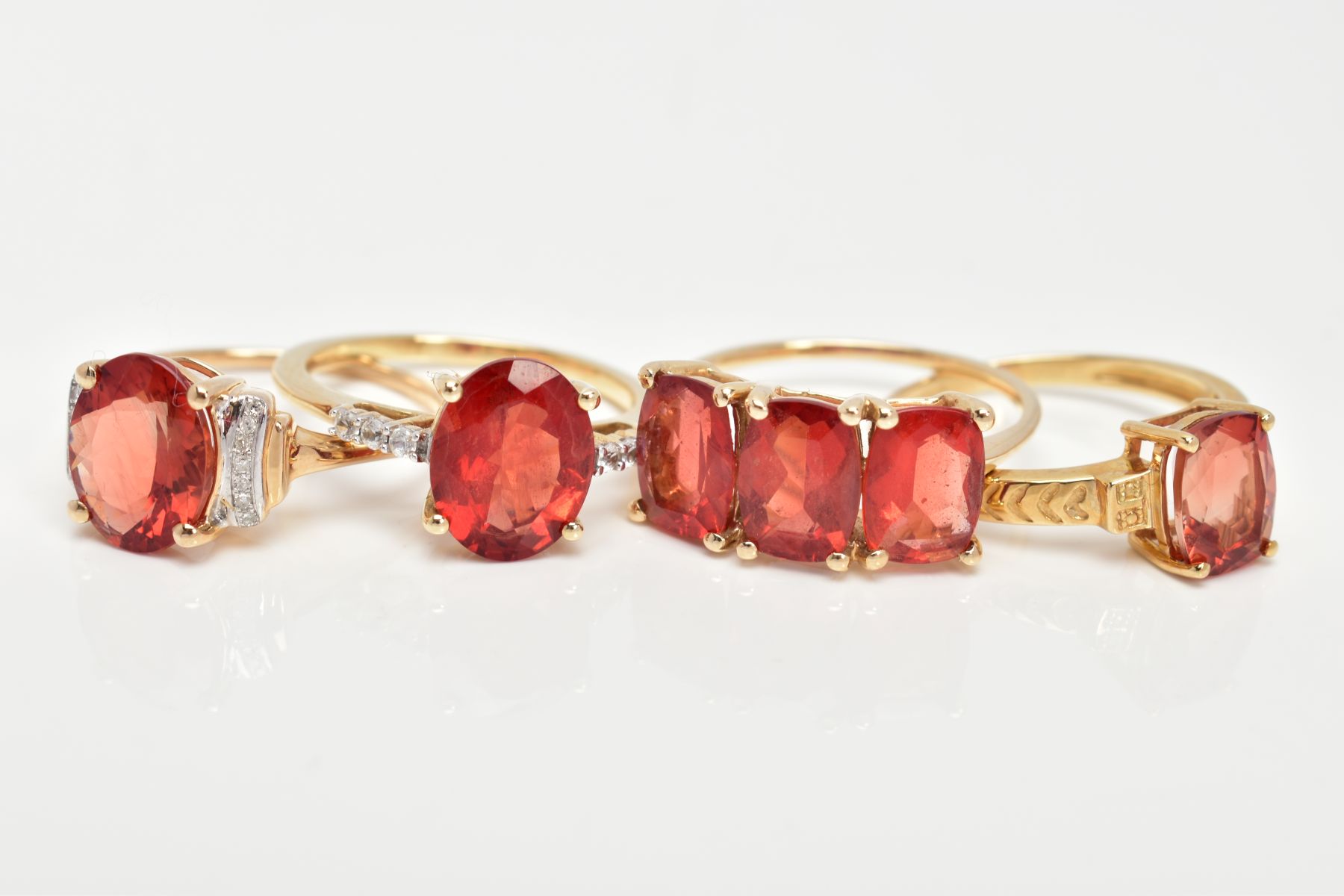 FOUR 9CT GOLD GEM SET RINGS, each set with orangish red stones possibly organ sunstone/Andesine, - Image 2 of 3