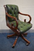 A MAHOGANY GREEN LEATHER BUTTONED SWIVEL OFFICE CHAIR