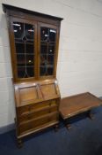 A 20TH CENTURY OAK LEAD GLAZED BUREAU BOOKCASE with three assorted drawers (two keys), and a