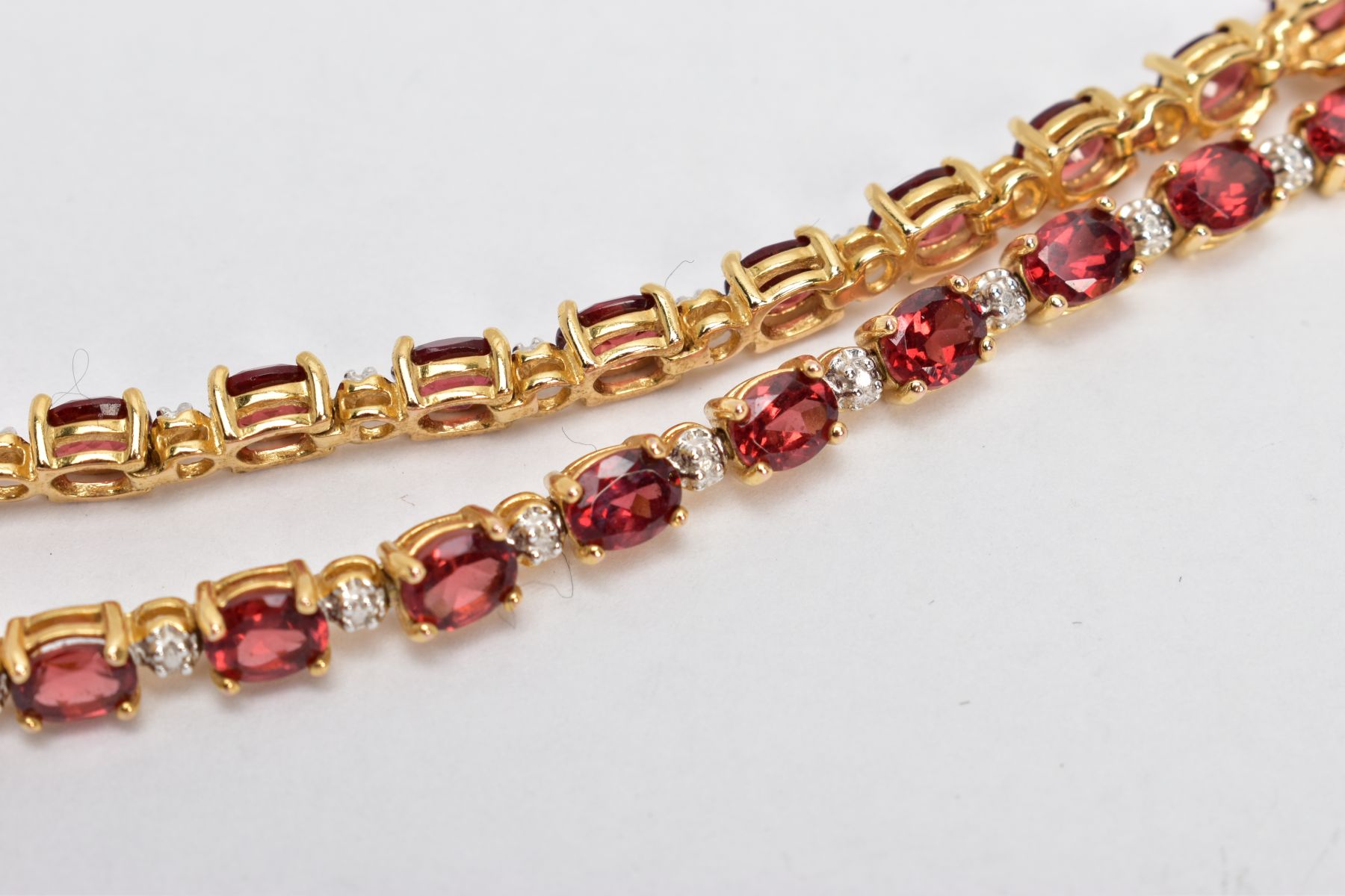 A SELECTION OF JEWELLERY, to include a silver gilt line bracelet, set with oval cut garnets, each - Image 2 of 9