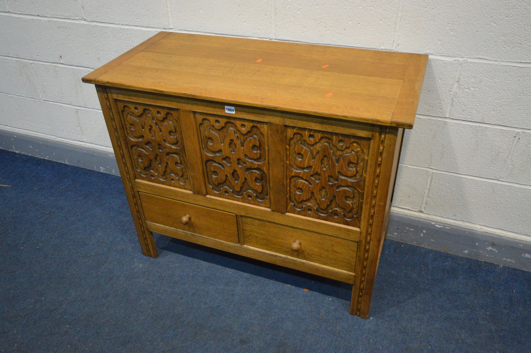 A 'HEATHLAND FURNITURE' OAK MULE CHEST, with blind fretwork detailing to the three front panels - Image 3 of 3