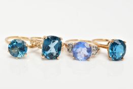FOUR 9CT GOLD GEM SET DRESS RINGS, each set with vary cut blue stones assessed as topaz and