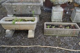 A COMPOSITE RECTANGULAR PLANTER, on twin separate bases, length 70cm x height 32cm along with