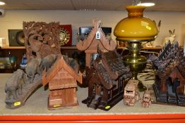 DECORATIVE WOODEN CARVINGS etc, to include Thai Spirit houses, one converted to a lamp, elephants