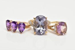 THREE 9CT GOLD AMETHYST DRESS RINGS, each set with vary cut amethysts, two set with single cut