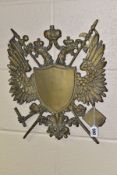A BRASS DOUBLE HEADED EAGLE WALL PLAQUE, vacant armorial to the centre, approximate dimensions