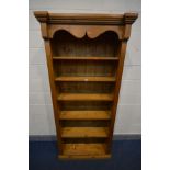 A TALL PINE OPEN BOOKCASE with five fixed shelves, width 97cm x depth 38cm x height 198cm