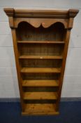 A TALL PINE OPEN BOOKCASE with five fixed shelves, width 97cm x depth 38cm x height 198cm