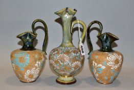 A PAIR OF DOULTON SLATERS PATENT STONEWARE EWERS AND ANOTHER SIMILAR, all three decorated in the