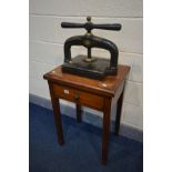 A VINTAGE CAST IRON BOOKPRESS, with a label reading William Mitchell, Birmingham & London, on a