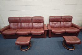 AN EKORNES STRESSLESS RED LEATHER RECLINING SUITE, comprising a three seater sofa, width 230cm,