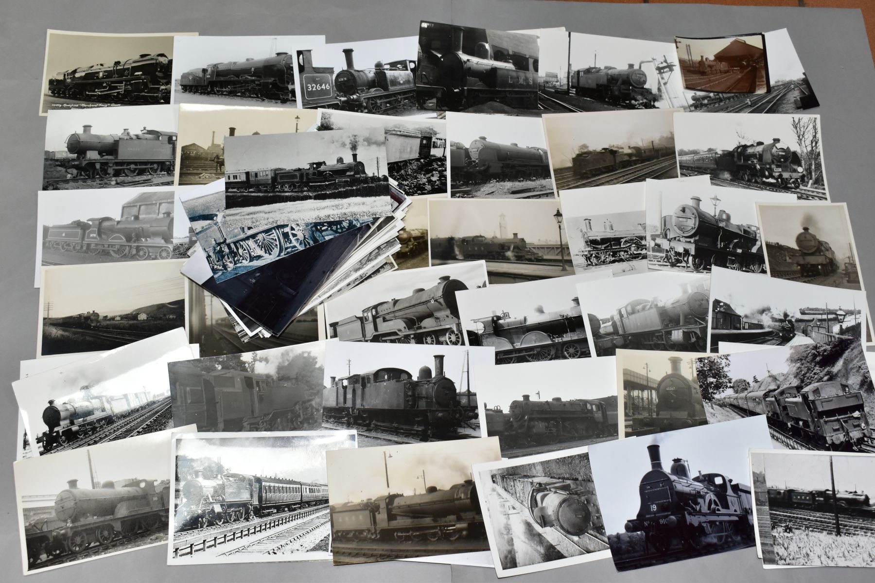 A QUANTITY OF ASSORTED MAINLY BLACK AND WHITE POSTCARD SIZE PHOTOGRAPHS OF BRITISH STEAM