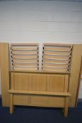 A NATURAL OAK 5FT BEDSTEAD, with two separate drop in slatted base (complete with bolts)