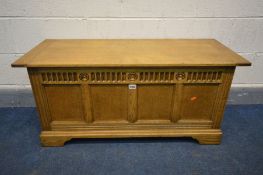 A 20TH CENTURY LIGHT OAK BLANKET BOX, with four panels on bracket feet, width 107cm x depth 43cm x