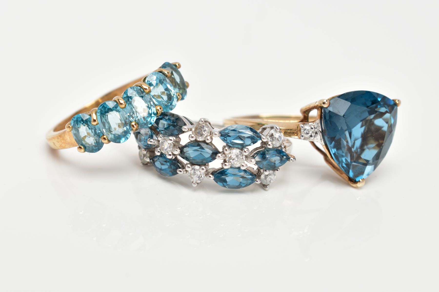 THREE 9CT GOLD GEM SET DRESS RINGS, the first a 9ct white gold ring set with blue and colourless - Image 2 of 3