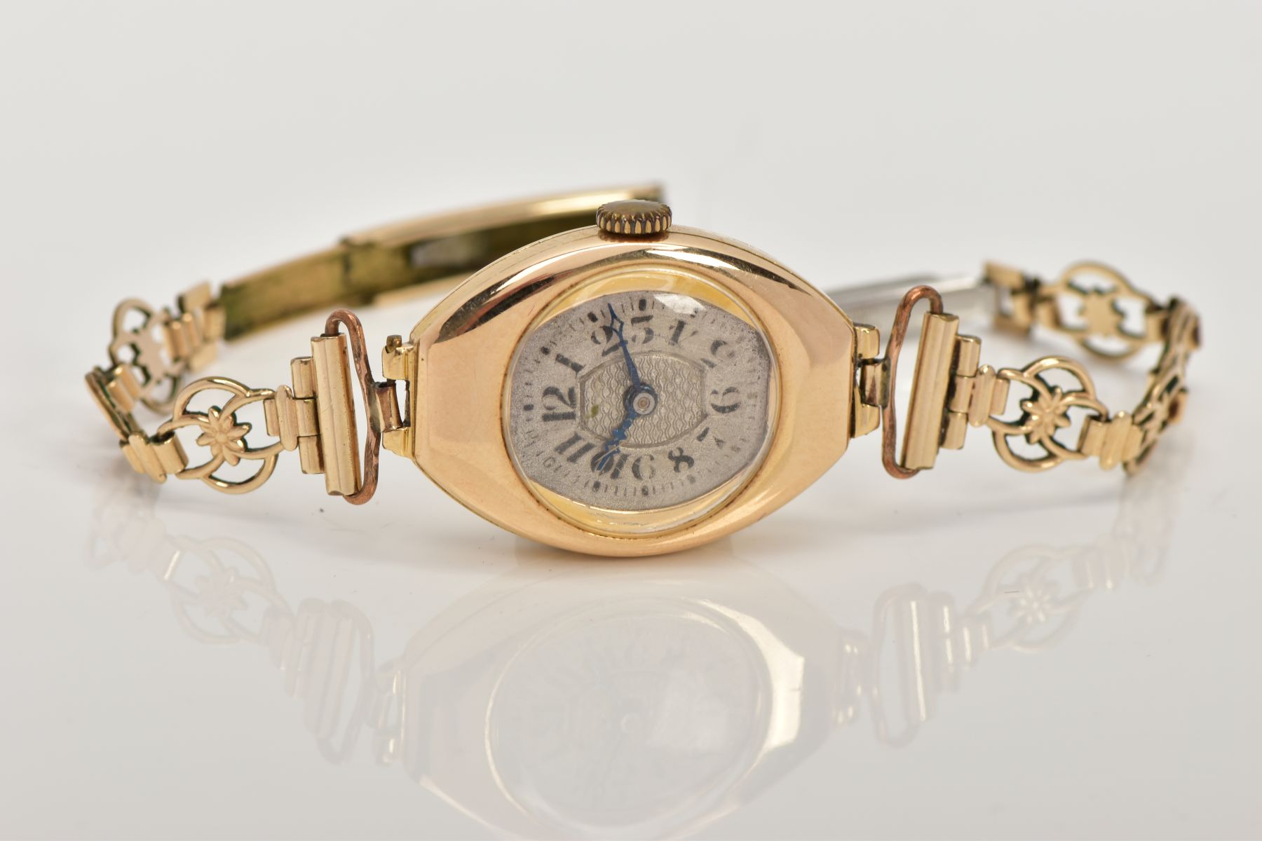 A LADY'S 18CT GOLD WRISTWATCH, hand wound movement, curved silver dial, Arabic numerals, blue hands, - Image 3 of 5