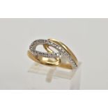 A YELLOW METAL DIAMOND RING, of an openwork crossover style, set with round brilliant cut