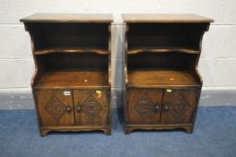A PAIR OF 20TH CENTURY OAK BEDSIDE CABINETS, shaped undershelf above carved double cupboard doors,