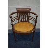 AN EDWARDIAN MAHOGANY AND MARQUETRY INALID TUB CHAIR