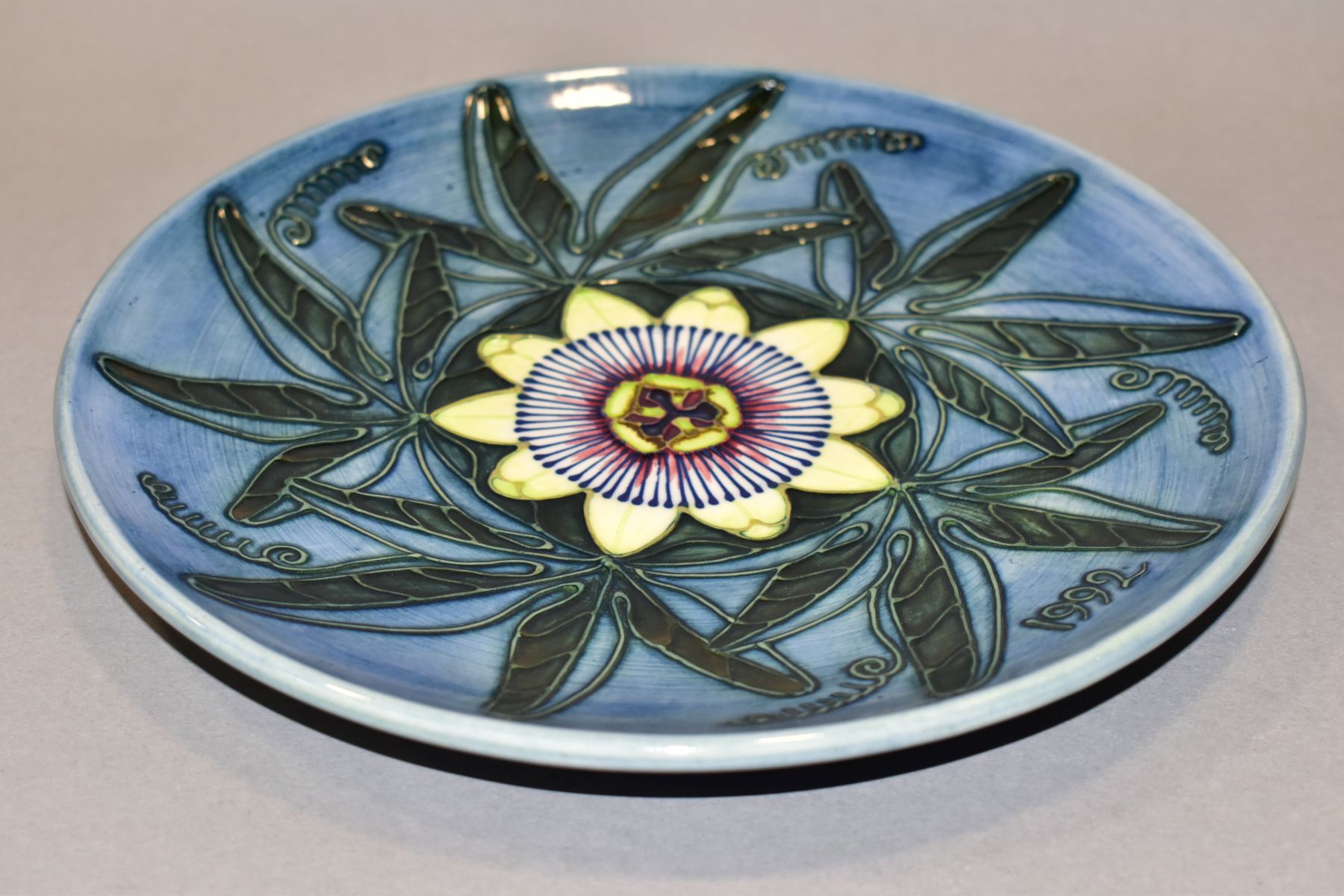 A MOORCROFT POTTERY LIMITED EDITION YEAR PLATE FOR 1992, second edition, passion flower design, - Image 3 of 4