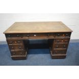 A VICTORIAN OAK PEDESTAL DESK, with a brown tooled leather inlay, and nine assorted drawers, on