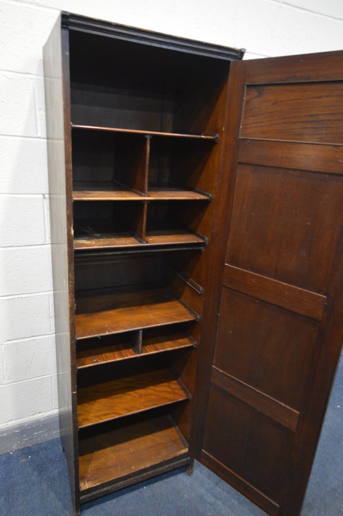 A SLIM 20TH CENTURY PANELLED OAK CUPBOARD, enclosing an arrangement of shelves width 56cm x 50cm x - Image 3 of 3