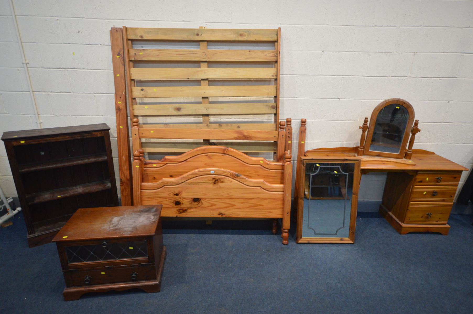A COLLECTION OF PINE FURNITURE, comprising a 4ft four poster bed frame, dressing table with two