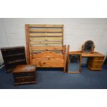 A COLLECTION OF PINE FURNITURE, comprising a 4ft four poster bed frame, dressing table with two