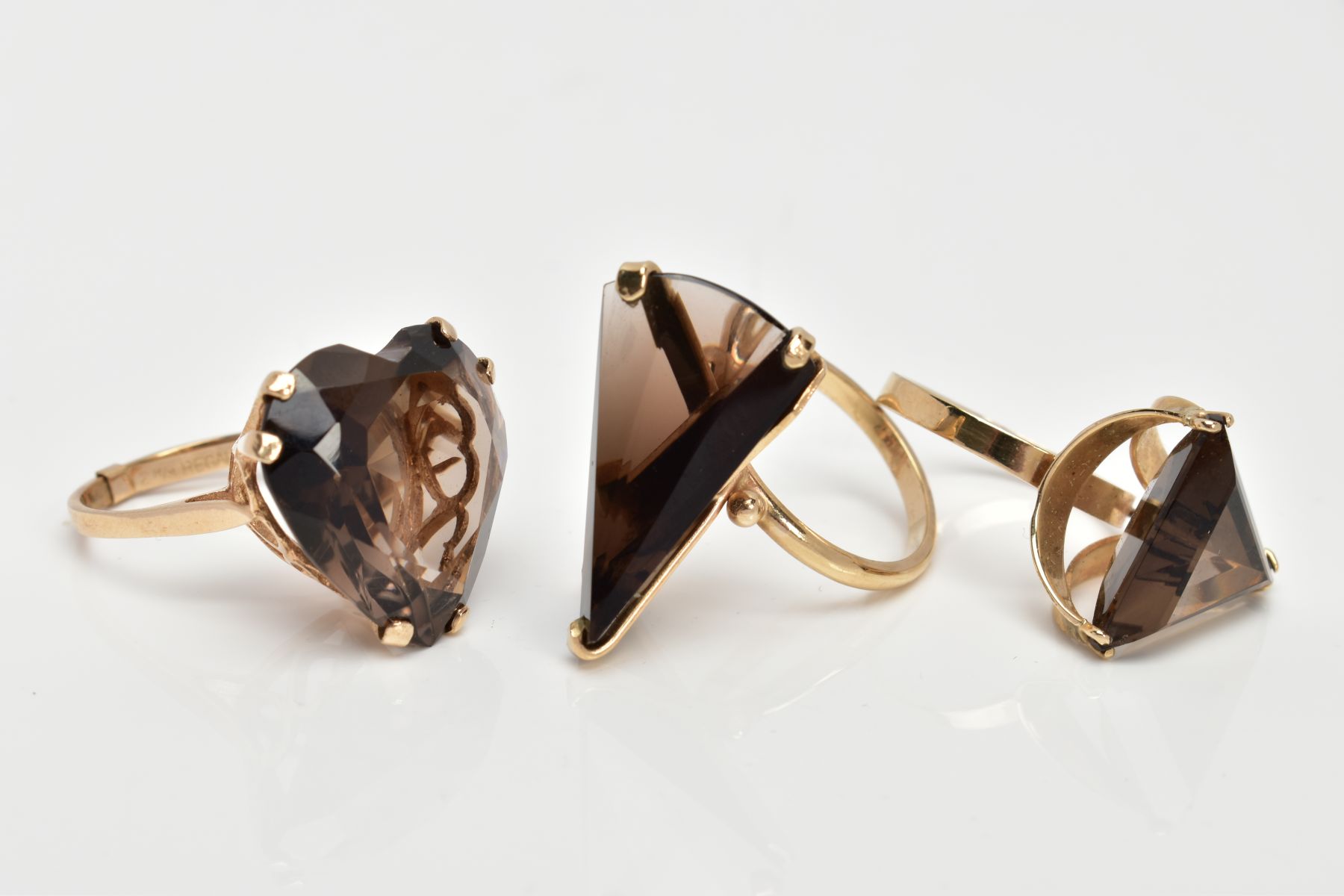 THREE 9CT GOLD SMOKEY QUARTZ DRESS RINGS, the first designed with a heart shaped Smokey quartz, - Image 2 of 3