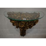 A GILT RESIN ROSE HEAD DECORATED CONSOLE TABLE, with a glass top, width 71cm x height 78cm