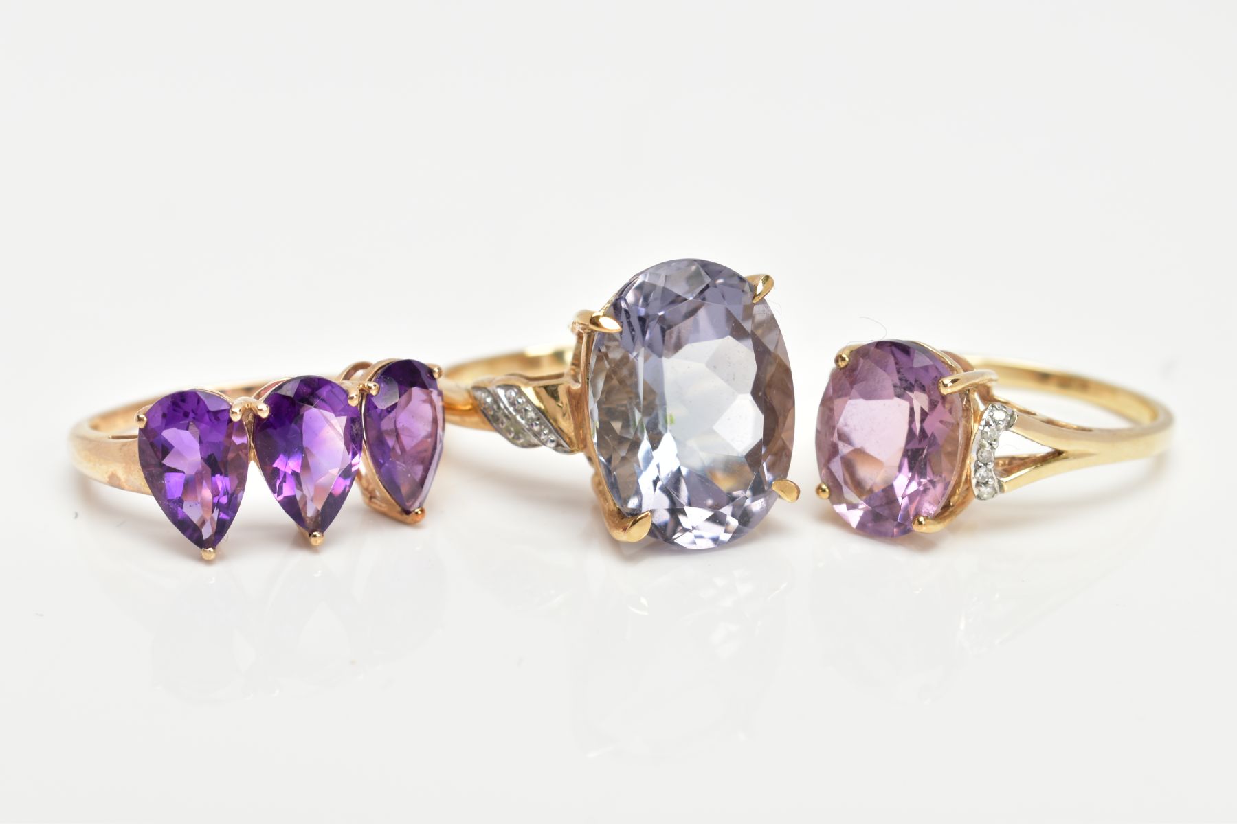 THREE 9CT GOLD AMETHYST DRESS RINGS, each set with vary cut amethysts, two set with single cut - Image 2 of 3