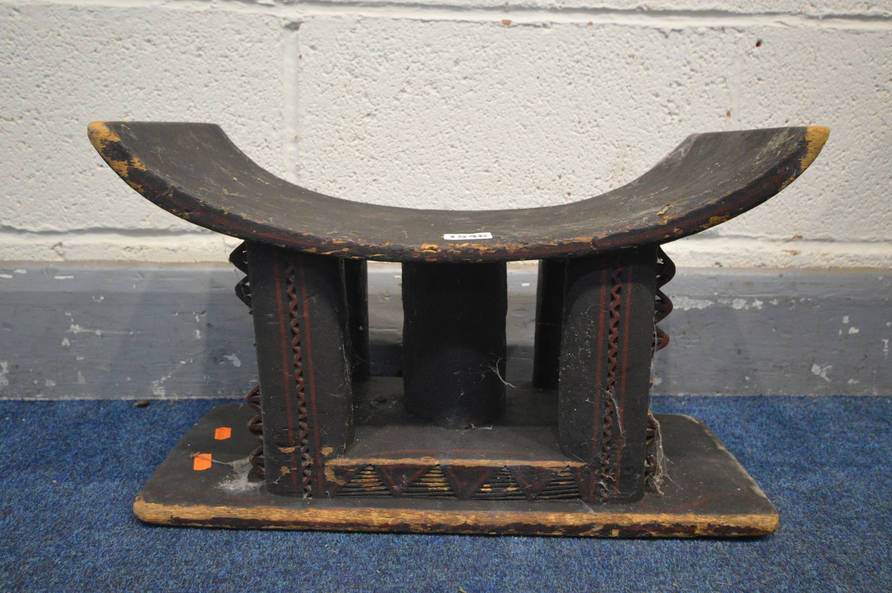 AN AFRICAN ASHANTI STOOL, length 45cm (condition:- work finish in places)