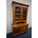 A LATE VICTORIAN PINE SIDEBOARD with a later glazed bookcase top, an arrangement of drawers and a