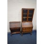 AN EARLY 20TH CENTURY OAK BUREAU BOOKCASE, the double glazed doors enclosing two adjustable shelves,