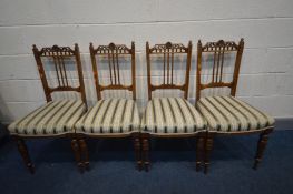 A SET OF FOUR LATE VICTORIAN WALNUT CHAIRS