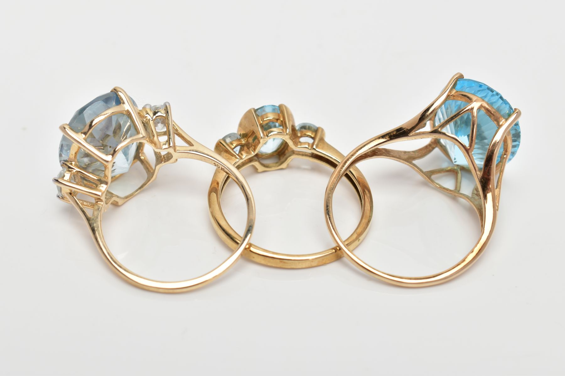 THREE 9CT GOLD DRESS RINGS, the first set with a central oval cut blue topaz, flanked with - Image 3 of 3