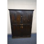 AN EARLY 20TH CENTURY STAINED PINE AND BEECH PANELLED DOUBLE DOOR HOUSEKEEPERS CUPBOARD, with four