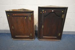 A GEORGIAN OAK CORNER CUPBOARD, width 79cm x depth 43cm x height 43cm together with another Georgian