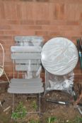 A BRAND NEW STILL WRAPPED FOLDING METAL GARDEN TABLE and two matching chairs (3)