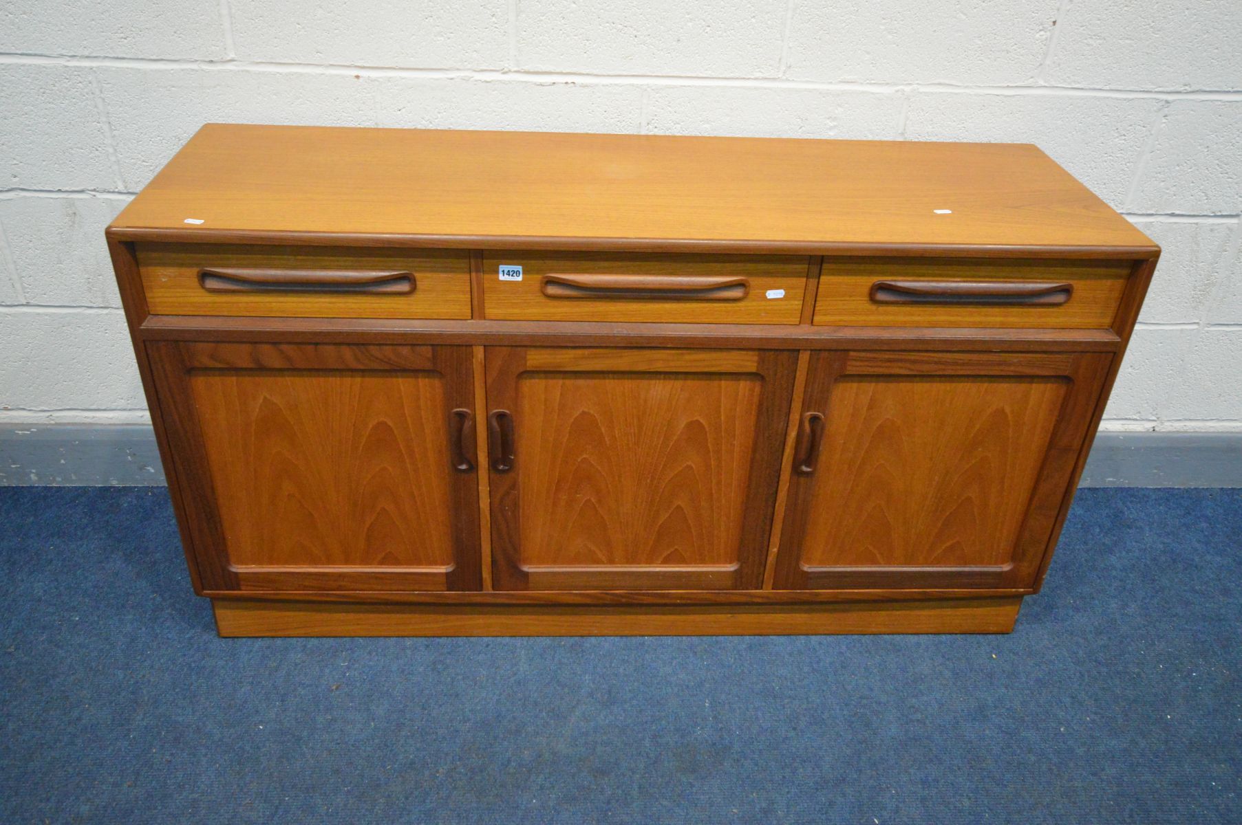 A G PLAN FRESCO TEAK SIDEBOARD, with three drawers above triple cupboard doors, width 143cm x