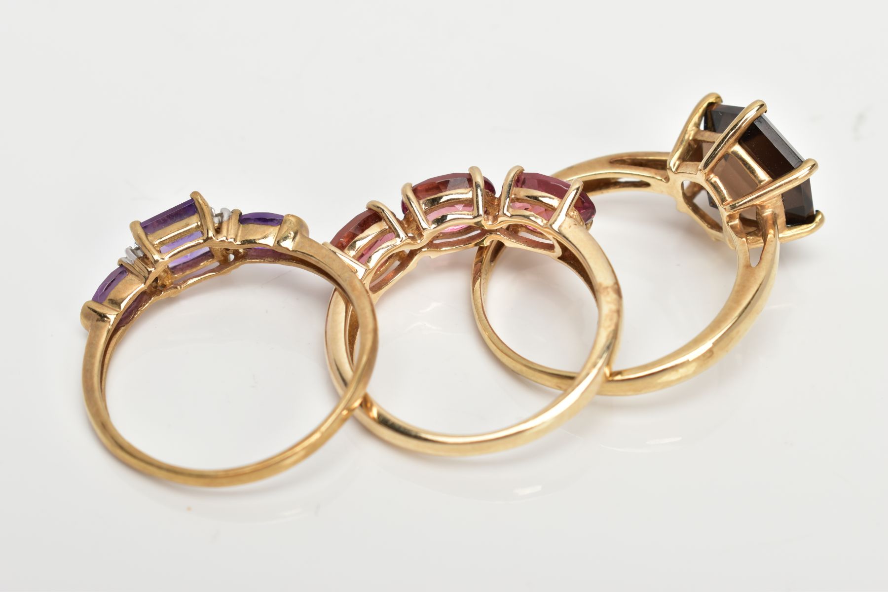 TWO 9CT GOLD GEM SET RINGS AND A YELLOW METAL AMETHYST AND DIAMOND RING, the first set with a - Image 3 of 3