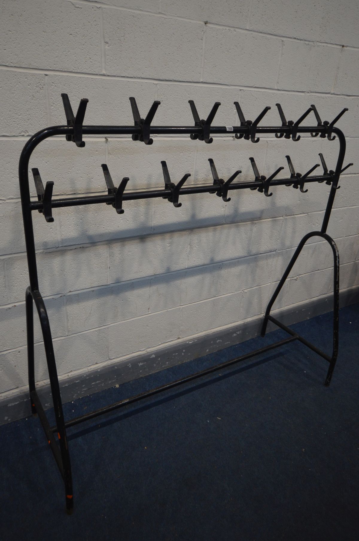 A TUBULAR DOUBLE SIDED SCHOOL COAT RACK, width 154cm x depth 57cm x height 157cm - this lot is the