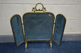 A BRASS TRIPLE BRANCH MIRRORED FIRE SCREEN, with central embossed detail