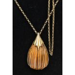 A LARGE ABSTRACT TIGERS EYE 9CT GOLD PENDANT AND CHAIN, a carved pear shape tigers eye stone